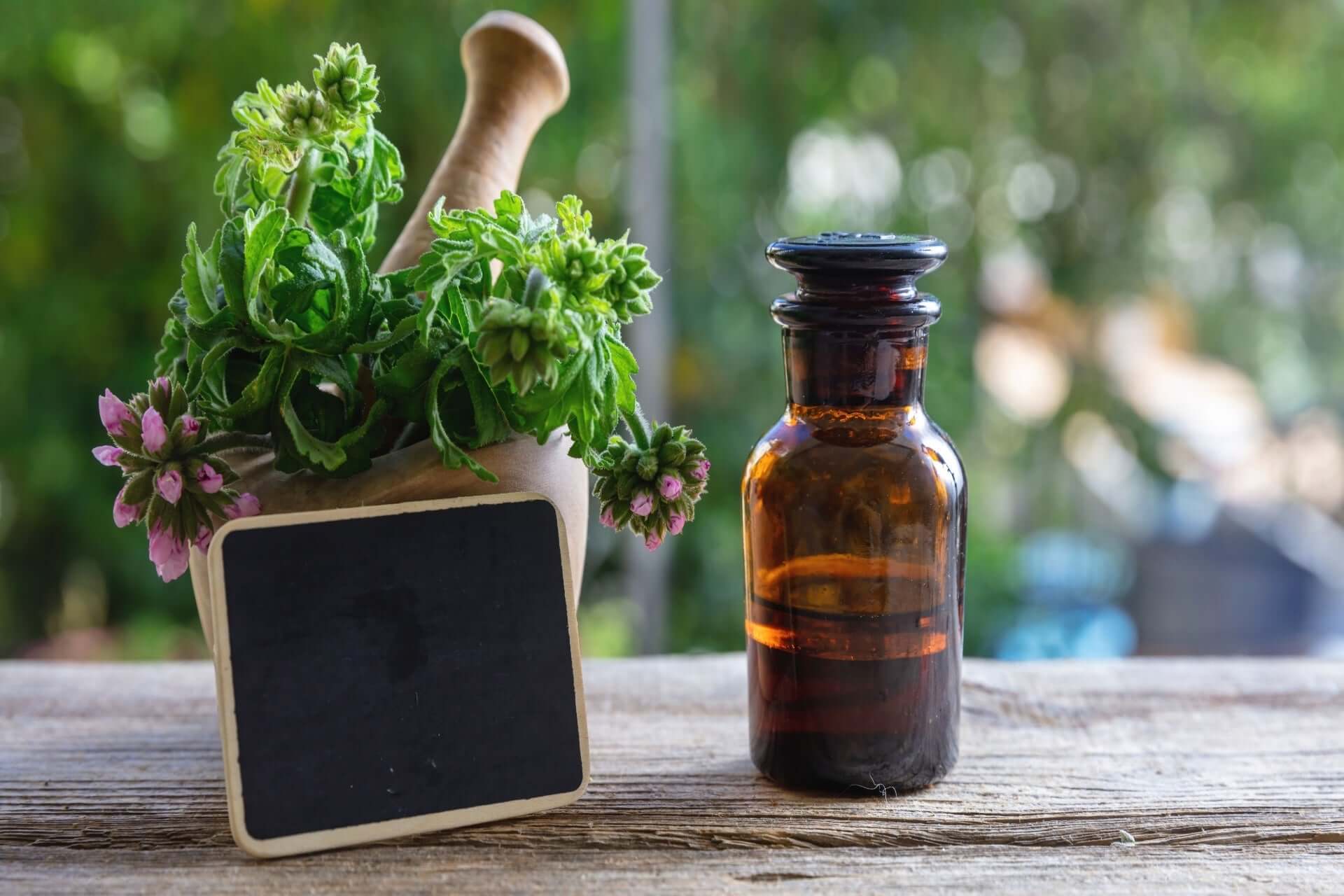 Amber glass apothecary bottle with natural mosquito repellent liquid